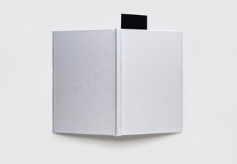 Blank book with a black bookmark on a white background