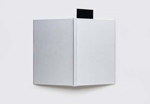 Blank book with a black bookmark on a white background