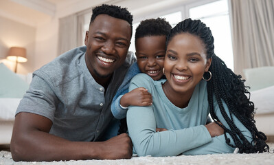 Obraz premium Portrait, black family and happy in house on floor for bonding, love and support with care. People, smile and together with confidence or laugh in living to relax, chill and fun on day off with trust