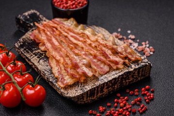 Delicious bacon in the form of slices with salt, spices and herbs