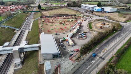 a large train yard with a big train on the tracks
