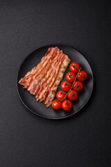 Delicious bacon in the form of slices with salt, spices and herbs