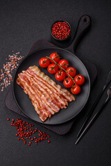 Delicious bacon in the form of slices with salt, spices and herbs
