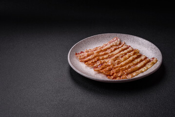 Delicious bacon in the form of slices with salt, spices and herbs