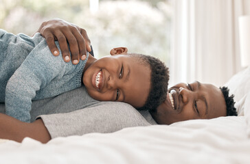 Portrait, boy and father in bed with hug, support and childhood development for love and affection. Black man, son and bonding in happy, together for care as family on weekend for memory or emotion