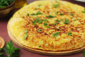 Frittata, traditional egg and potato omelette, Italian dish	