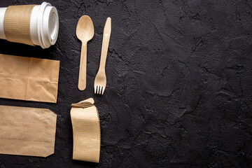 food delivery with paper bags and plastic cup on dark table background top view mockup