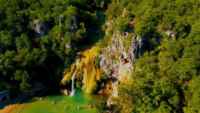 Ascending drone shot of Turner Falls in the Arbuckle Mountains of south-central Oklahoma, USA