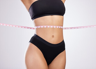 Person, underwear and tape measure or lose weight results in studio with waist goals, fitness or...