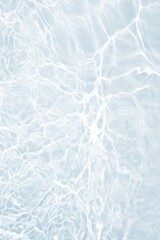 Blue water with ripples on the surface. Defocus blurred transparent blue colored clear calm water surface texture with splashes and bubbles. Water waves with shining pattern texture background.	