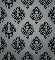 Wallpaper in the style of Baroque. Seamless vector background. Gray and black floral ornament. Graphic pattern for fabric, wallpaper, packaging. Ornate Damask flower ornament