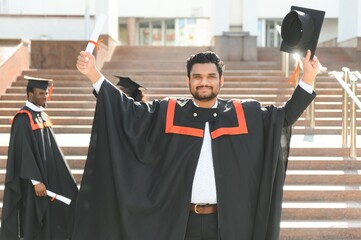 education, graduation and people concept - happy Indian Male graduate student