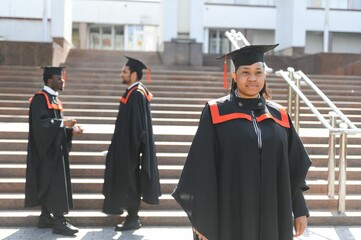 pretty african female college graduate at graduation