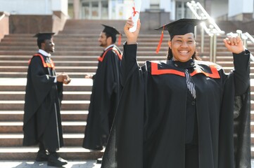 pretty african university graduate at graduation ceremony