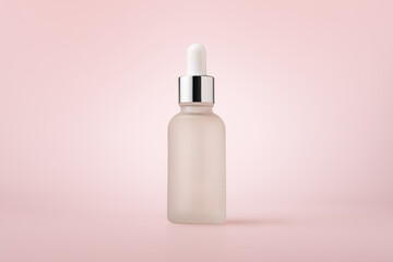 White glass dropper serum bottle