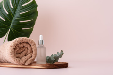 Cotton bath towel and serum dropper bottle