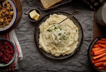 Top view of a bowl of mashed potatoes and mixed vegetables
