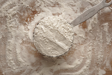 Baking utensil with flour on a flour-covered table surface