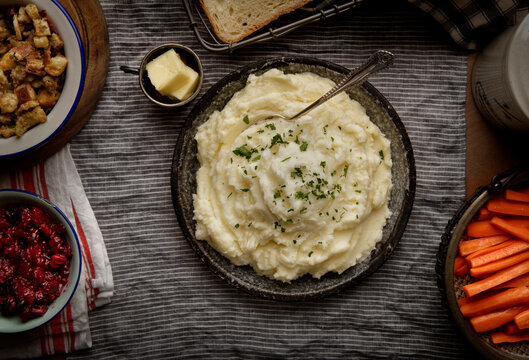 Top view of a bowl of mashed potatoes and mixed vegetables