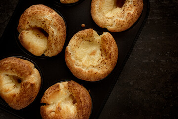 Top view of a pan filled with freshly baked Yorkshire Puddings