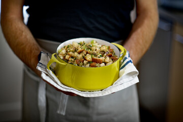 Chef displaying savory Thanksgiving turkey stuffing