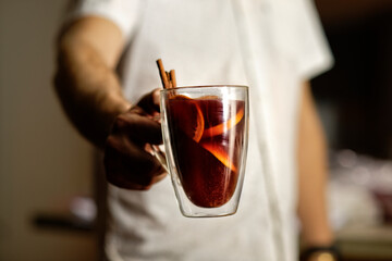 Chef presenting a glass of delicious mulled wine