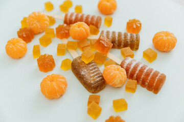 Homemade marmalade with juice mandarin fruits. Flat lay, top view