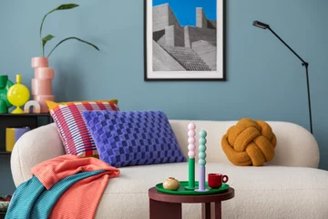 Fototapete Boho Modern and colorful interior of living room with design boucle sofa, mock up poster, shelf, plants, decorations and personal stuff. Home decor..  © FollowTheFlow