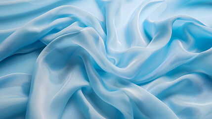 Obraz premium Blue silk fabric. A very lightweight viscose fabric with rich drapery and a smooth texture with a subtle matte sheen. background texture, pattern. smooth satin texture, very delicate