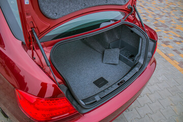 Large open trunk of a red car