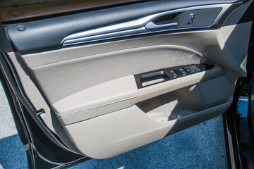 Gray upholstery with black leather inside car door