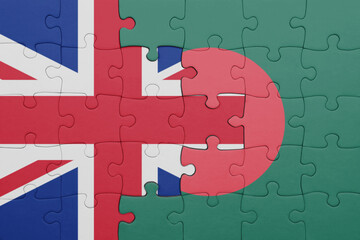 puzzle with the colourful national flag of bangladesh and flag of great britain.