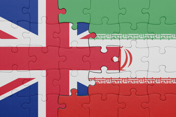 puzzle with the colourful national flag of iran and flag of great britain.
