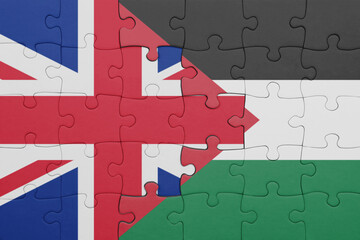 puzzle with the colourful national flag of palestine and flag of great britain.