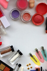Various colorful beauty products on white background. Top view.