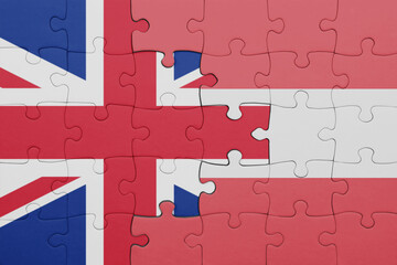 puzzle with the colourful national flag of austria and flag of great britain.