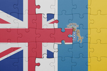 puzzle with the colourful national flag of canary islands and flag of great britain.