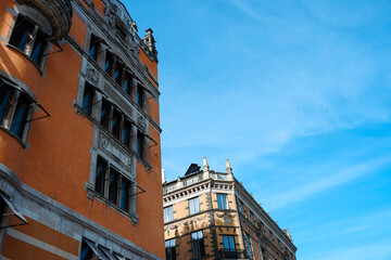 Fototapeta premium Low angle view of buildings against blue sky