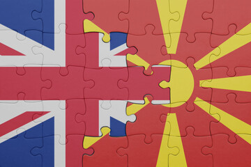 puzzle with the colourful national flag of macedonia and flag of great britain.