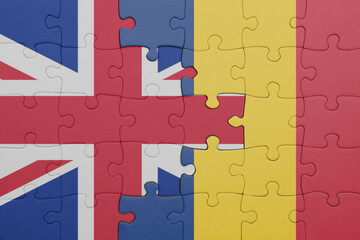 puzzle with the colourful national flag of romania and flag of great britain.