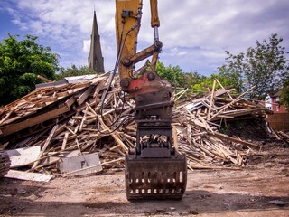 Demolition Machine in front of Rubble