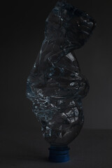 water bottle, rumpled, glows like crystal or ice