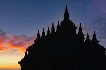 Beautiful colors of morning sky over silhouette of Plaosan temple in Yogyakarta