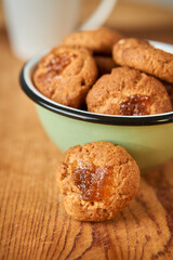 A bowl with pepas cookies on a table