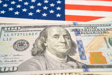 US dollar banknotes on USA America flag background, Business and finance.