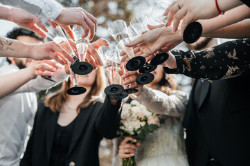 wedding guests exchange glasses of champagne