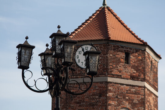 Town hall tower with a street lamp. Żnin, Poland.