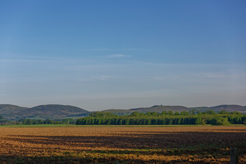 Looking North towards the Angus Glens and Tulloch Hill with the Airlie Monument, from the flat floor of the Strathmore Valley near to the Village of Memus.