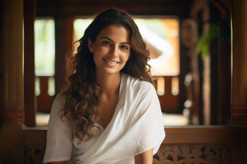A beautiful woman sitting and relaxing in an ayurvedic spa