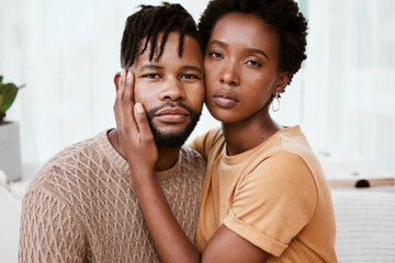 Portrait, black couple and embrace in living room, man and woman with love, romance and relax in...